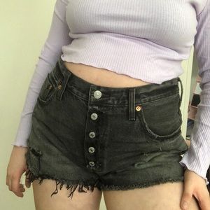 Black distressed Levi cutoff shorts